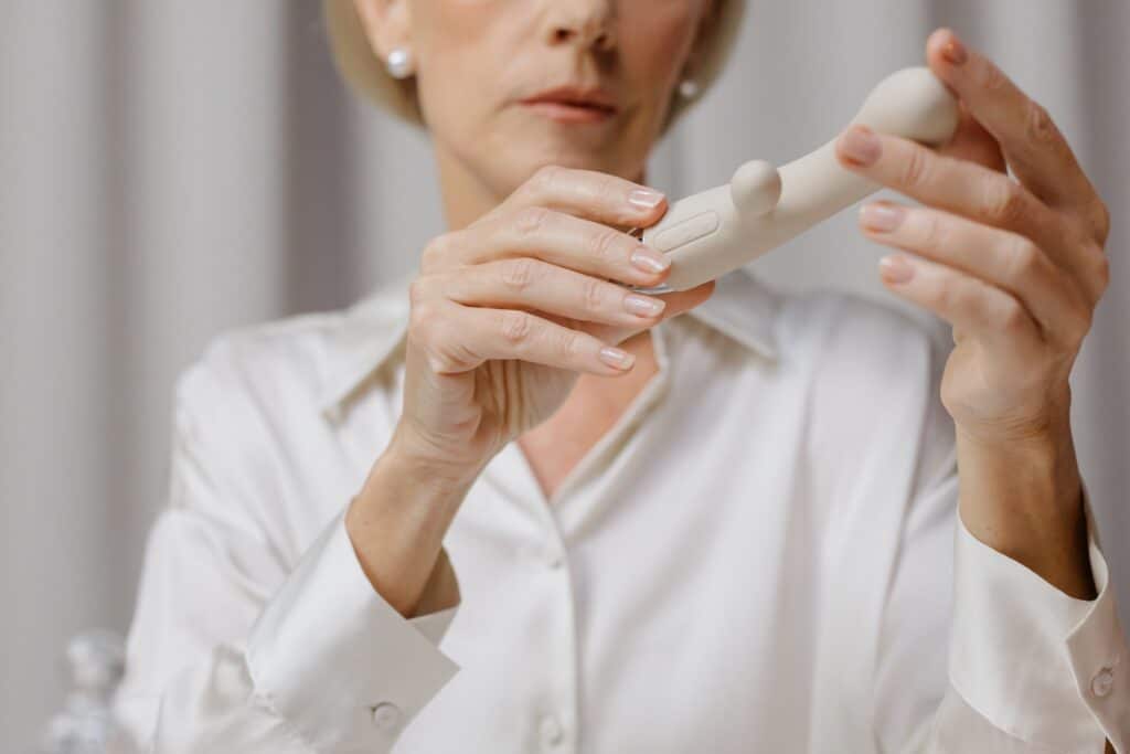 women holding a sex vibrator
